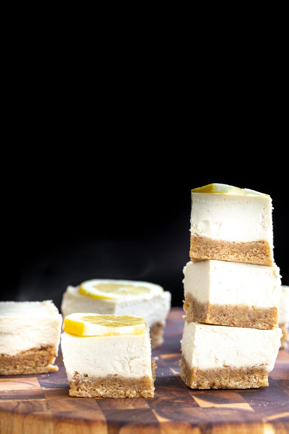 vegan lemon bars on a wooden chopping board