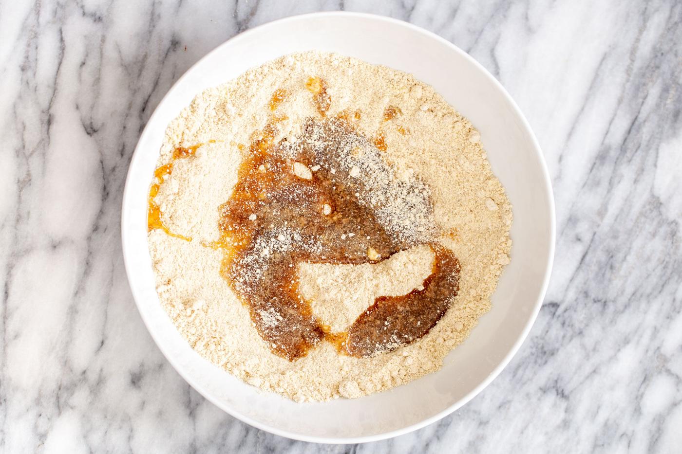 lemon bars crust being mixed in a bowl