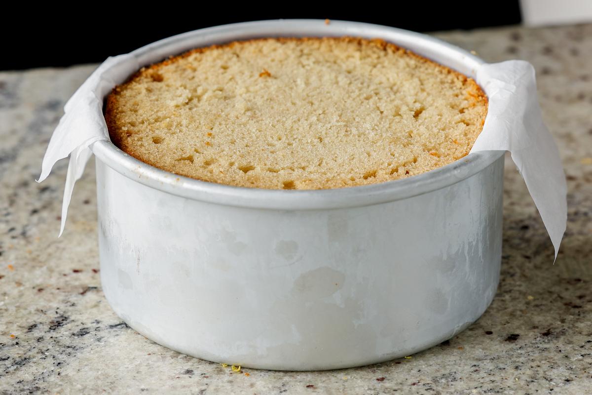adding the second cake layer to the pan