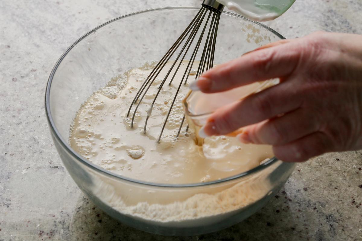 adding wet ingredients to the dry