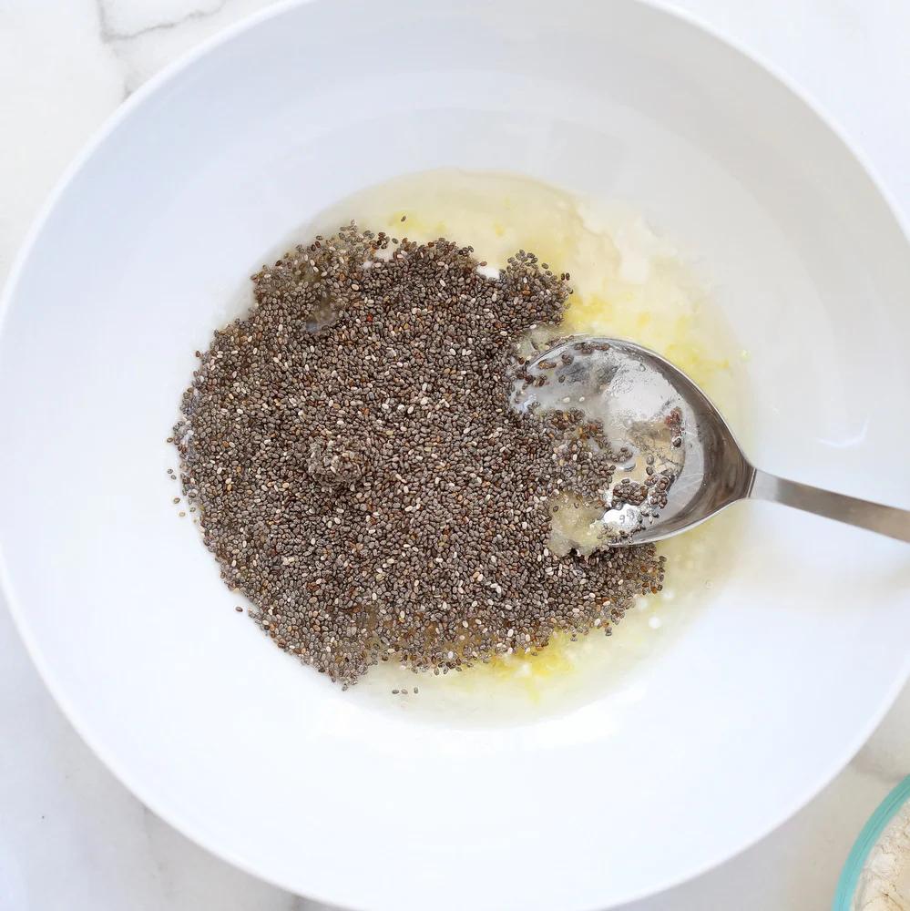 Vegan Lemon Cookie Prep with wet ingredients and chia seeds in a while bowl