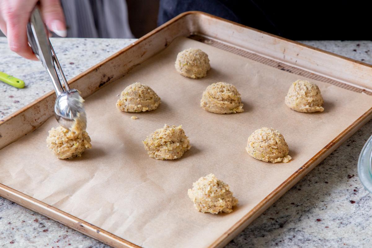 scooping dough onto the cookie sheet