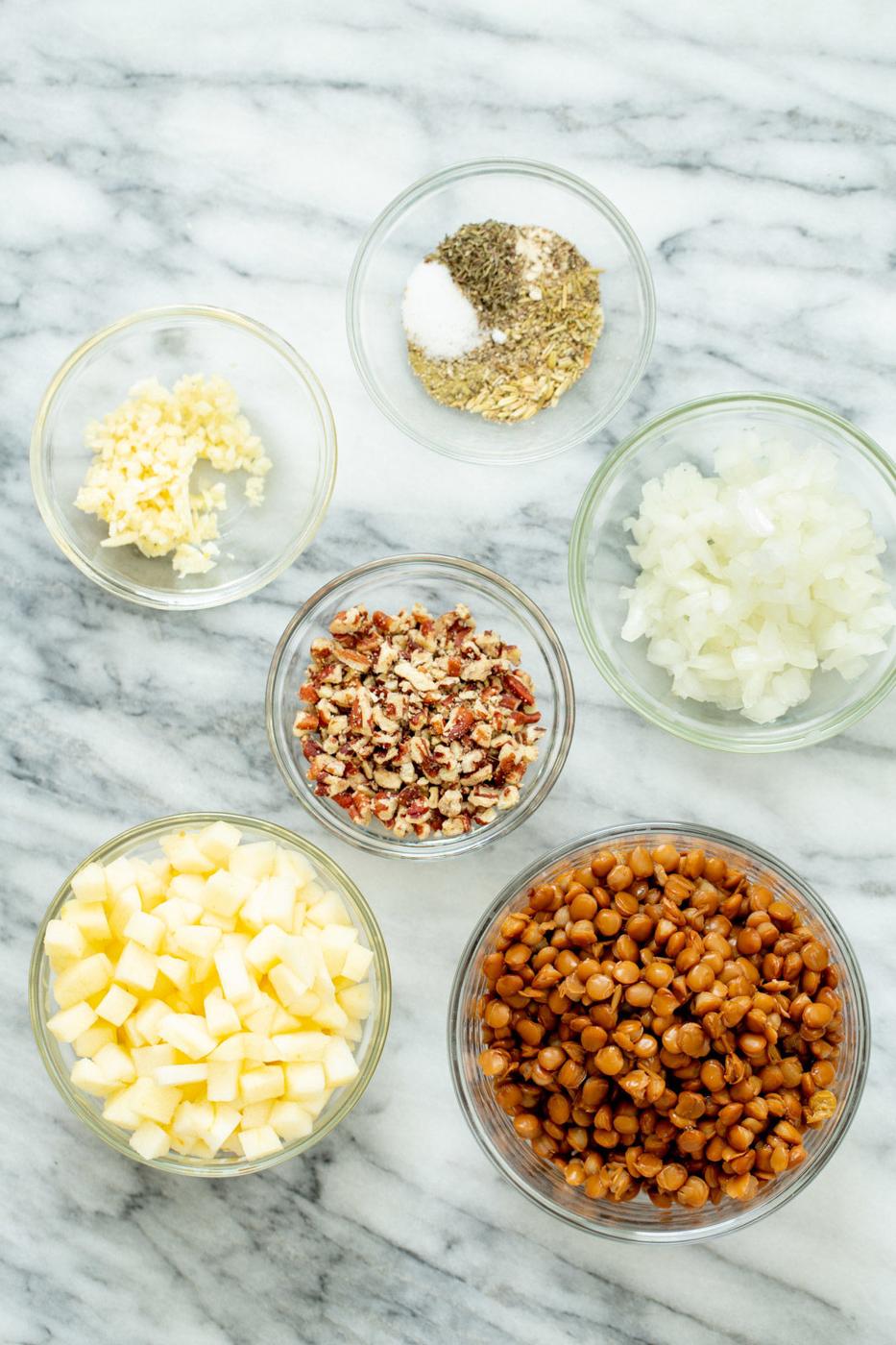 ingredients for making vegan stuffed butternut squash on a marble countertop