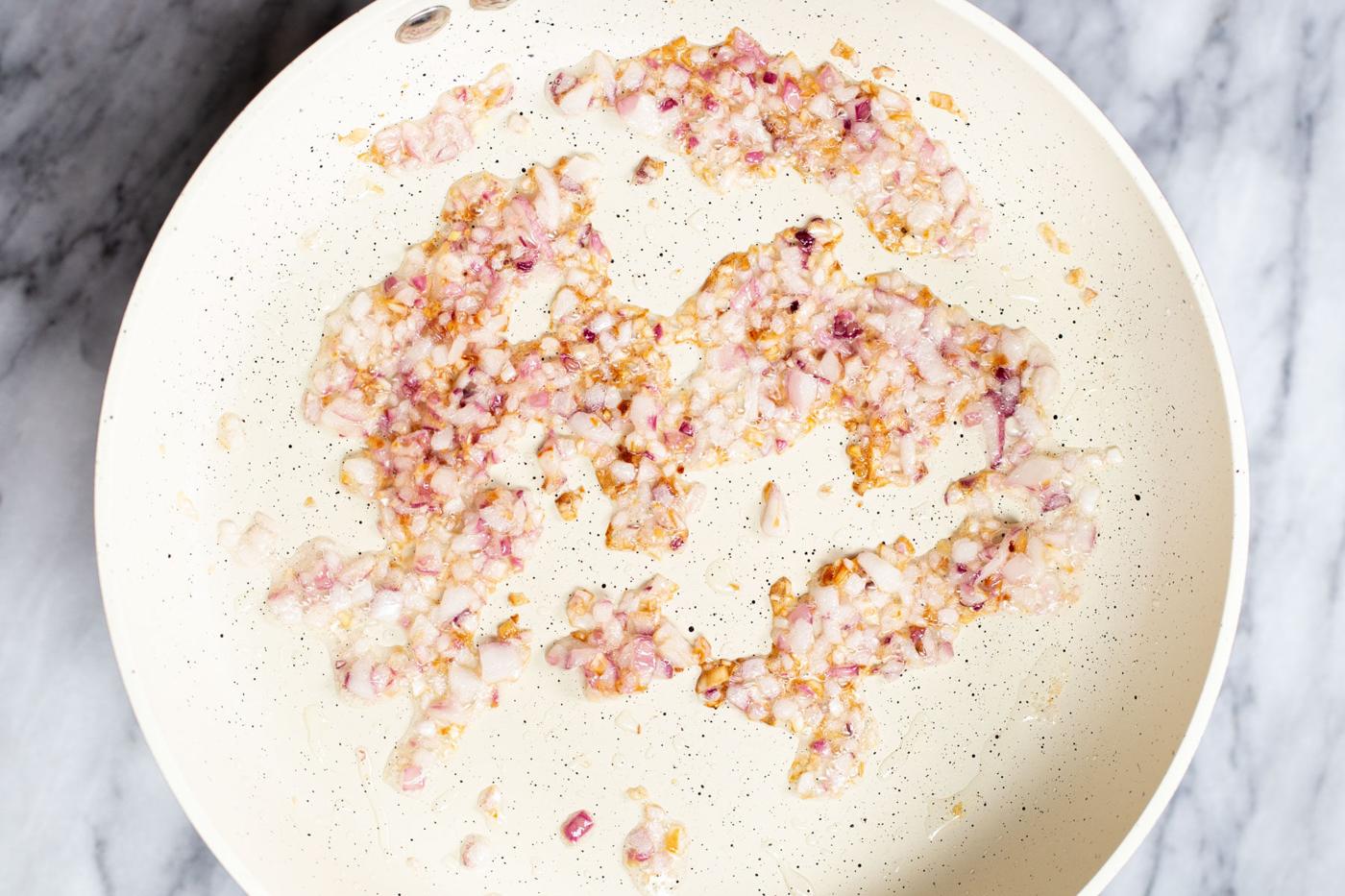 sauteeing pan with diced fried red onions
