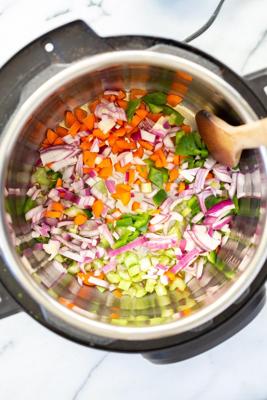 Onion pepper celery carrots in Instant Pot pressure cooker for our Vegan Lentil Sloppy joes