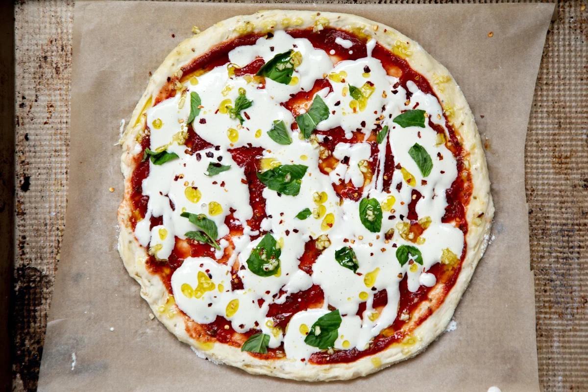overhead shot of vegan mozzarella pizza ready to be baked