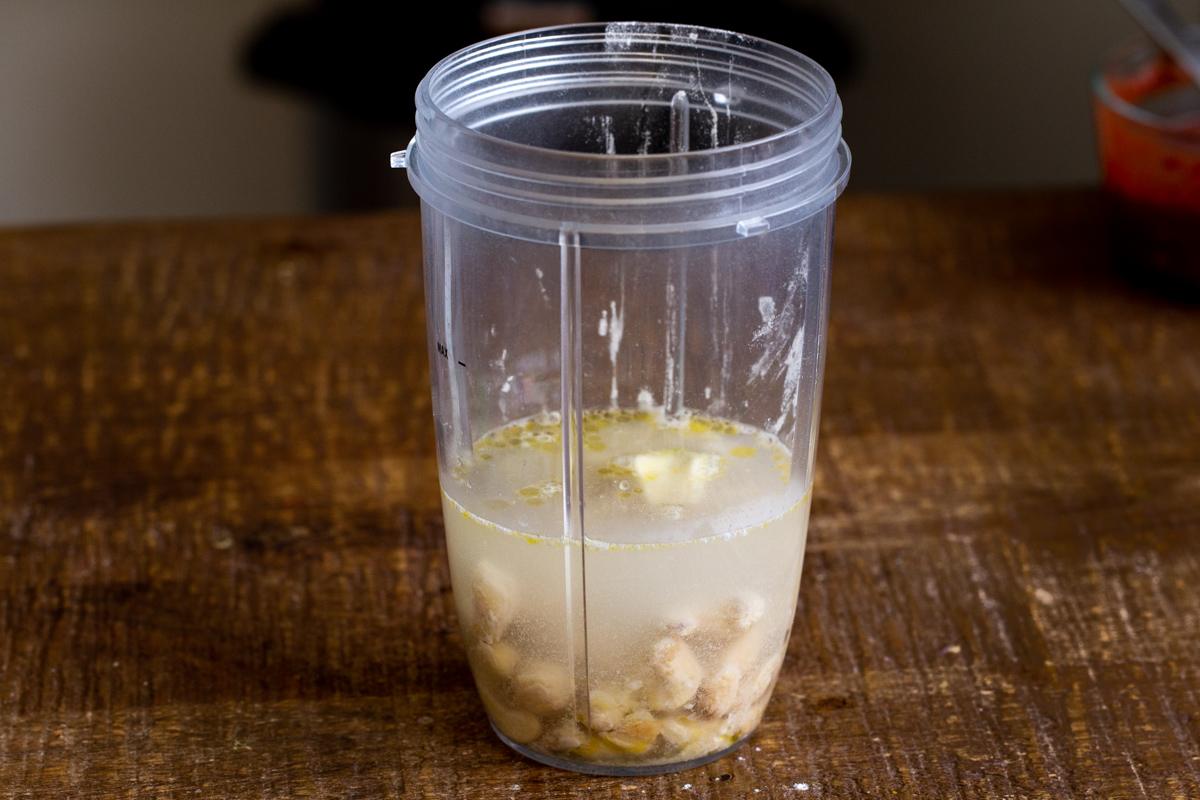 ingredients for vegan mozzarella cheese sauce in a measuring cup