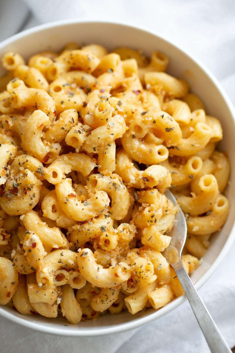 Mac and Cheese made with Vegan Mac and Cheese Powder in a while bowl
