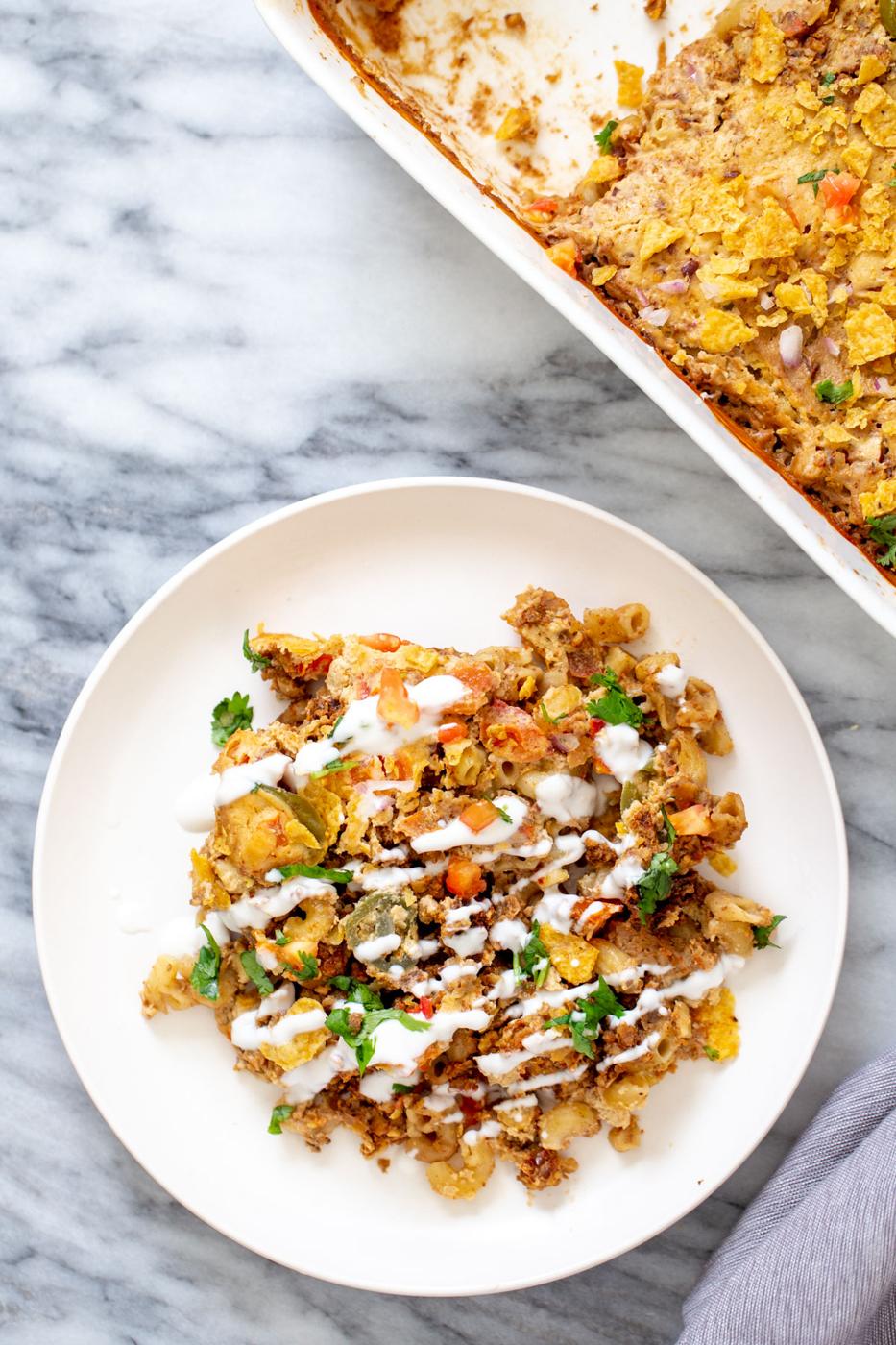 a serving of vegan taco bake with walnut taco meat and vegan cashew queso