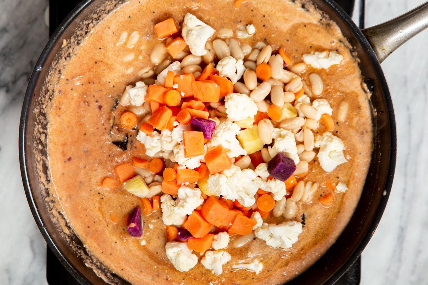 malabar curry sauce with veggies in a skillet