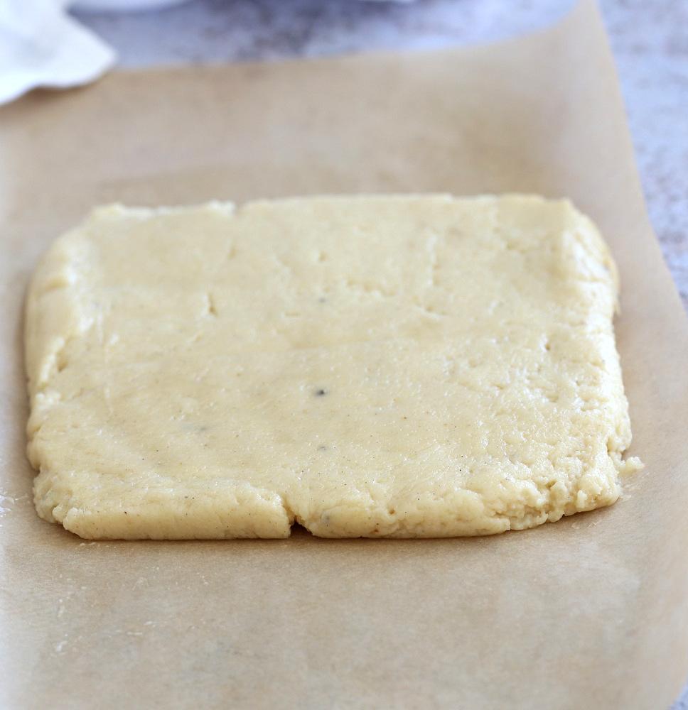 Making our Vegan Malai Burfi - Shaping burfi mixture onto parchment