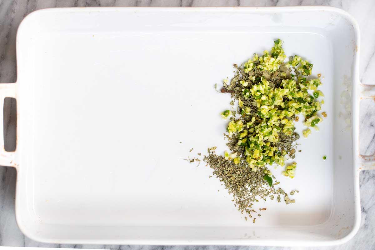 spices, garlic, ginger, and chilis in a baking pan