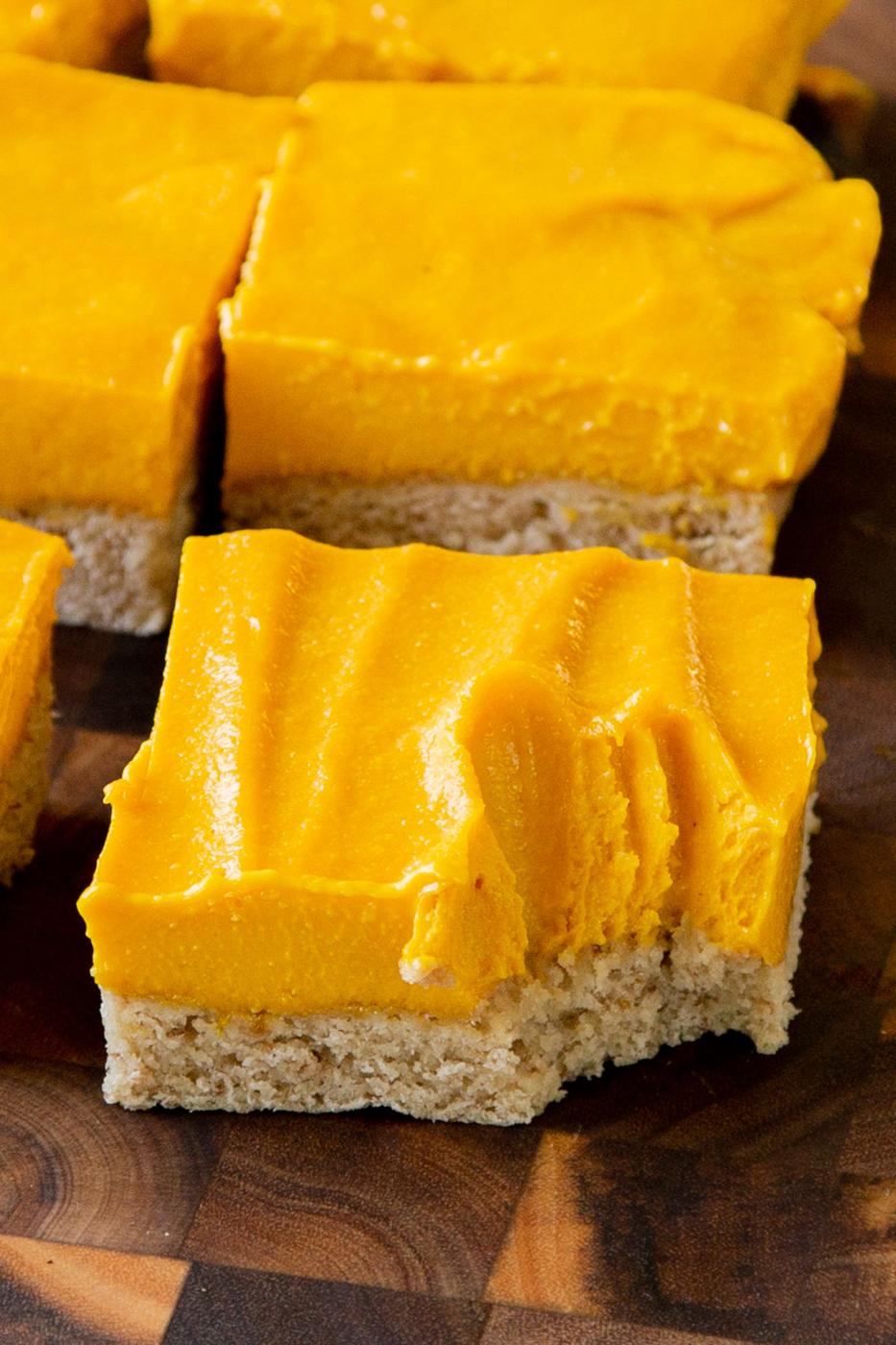 close-up of a mango bar with a bite taken out, so you can see the texture