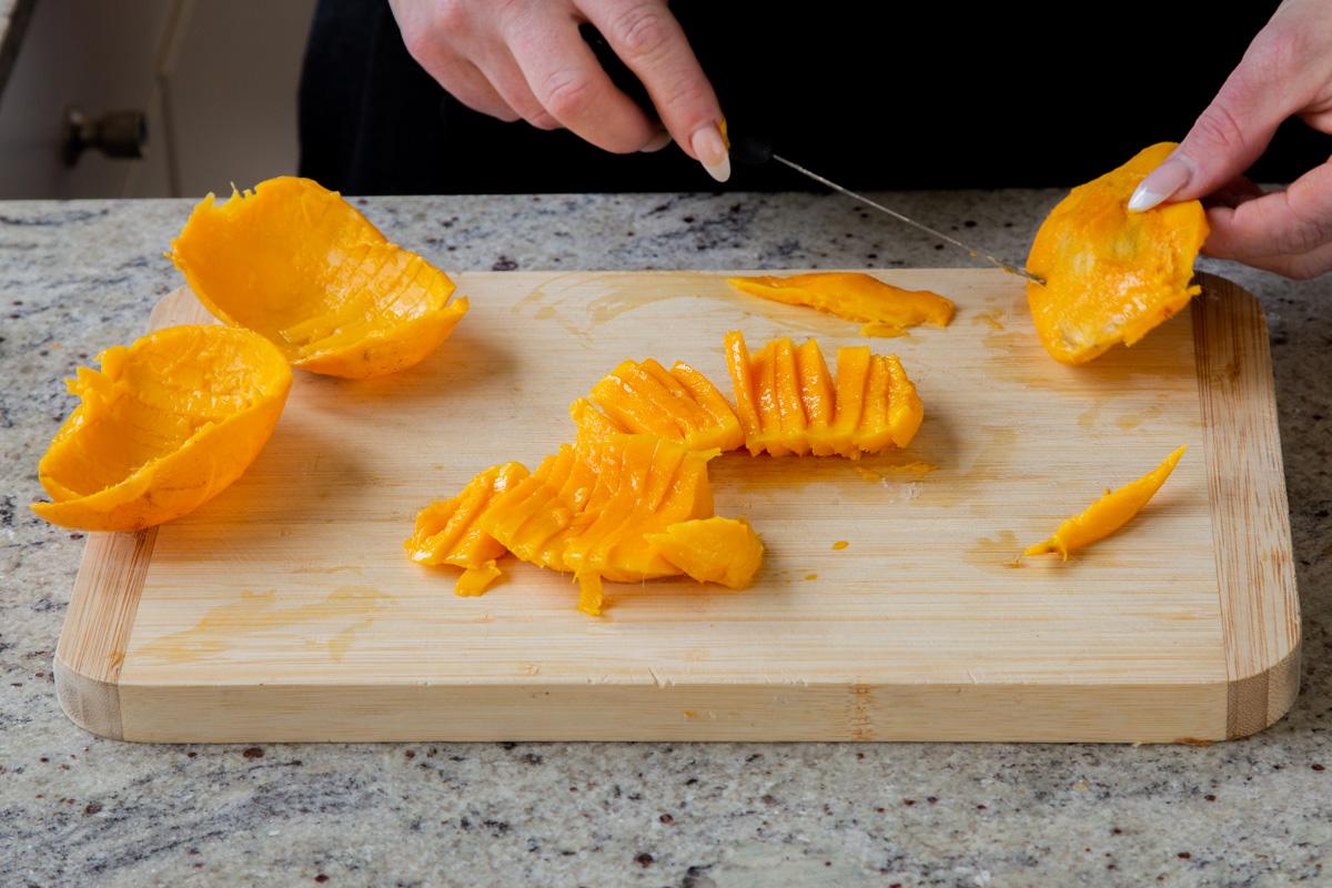 slicing up fresh mango