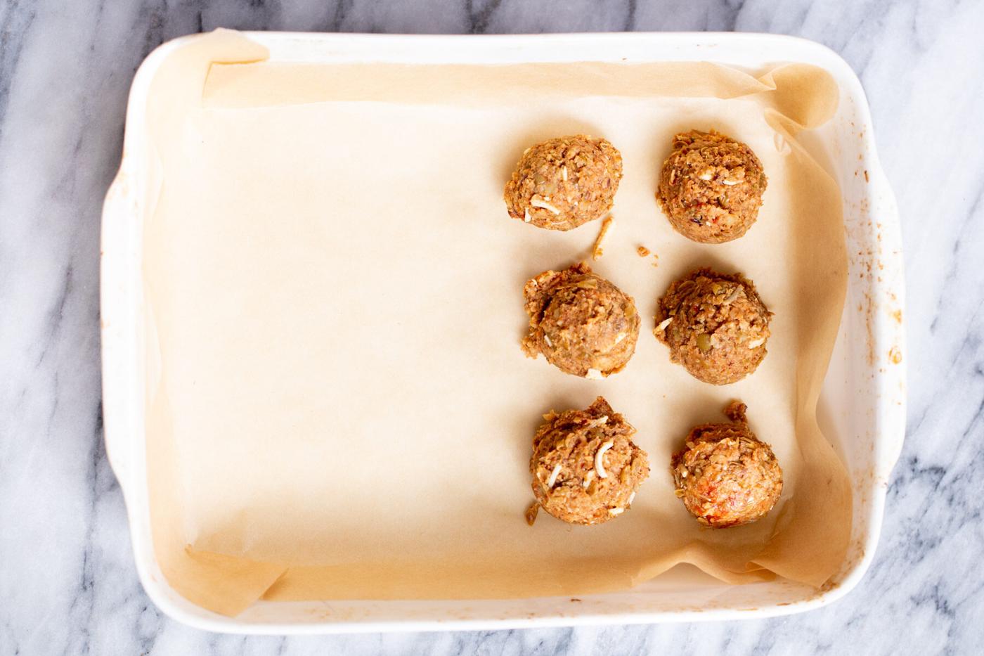 vegan lentil meatballs in a white casserole dish