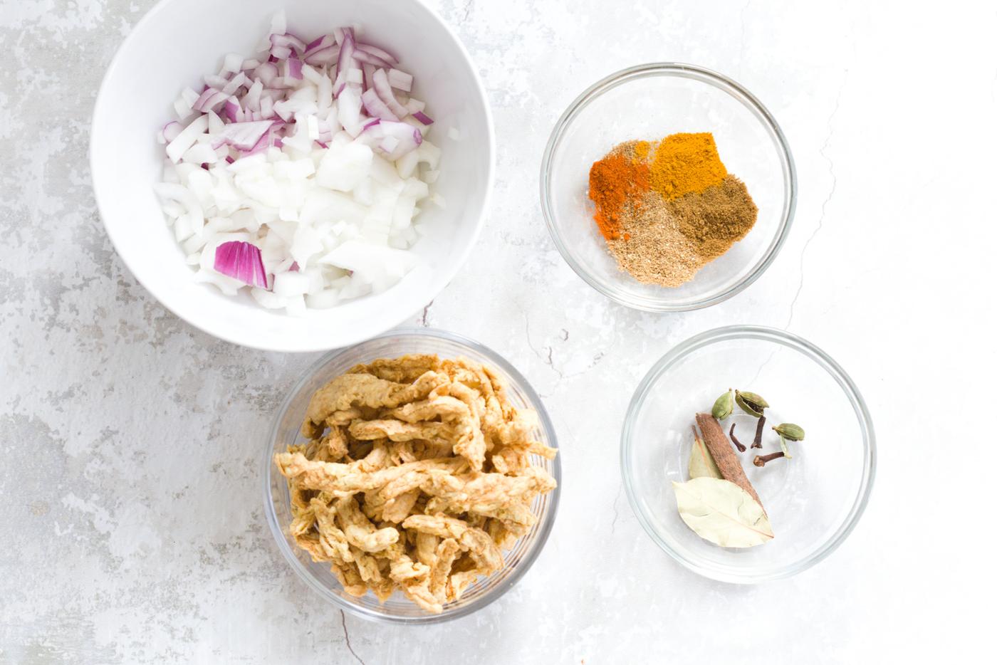 overhead shot of ingredients needed for making Instant Pot vegan methi chicken curry recipe