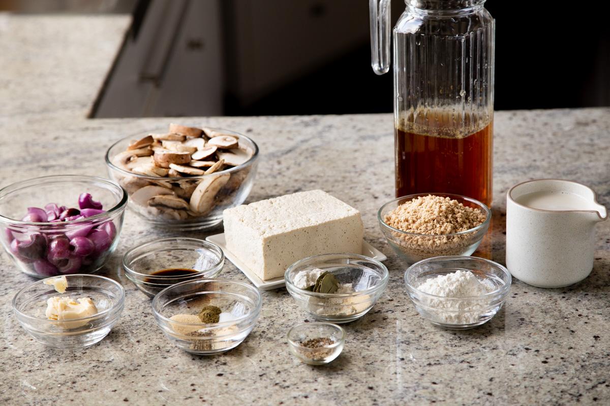 mushroom gravy and tofu schnitzel ingredients on a kitchen counter