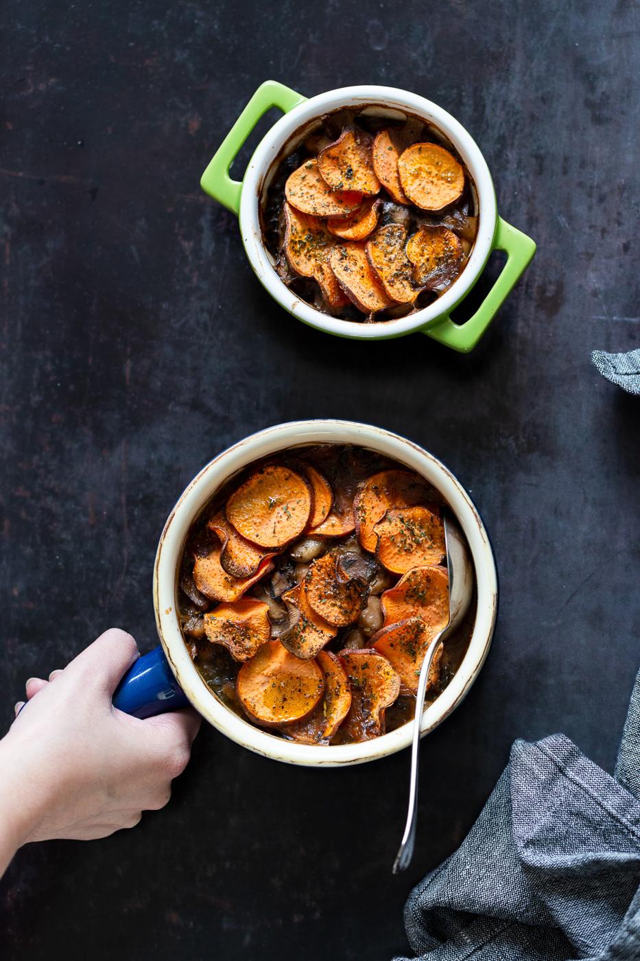 Our Vegan Mushroom Pot Pie in green and blue baking dishes