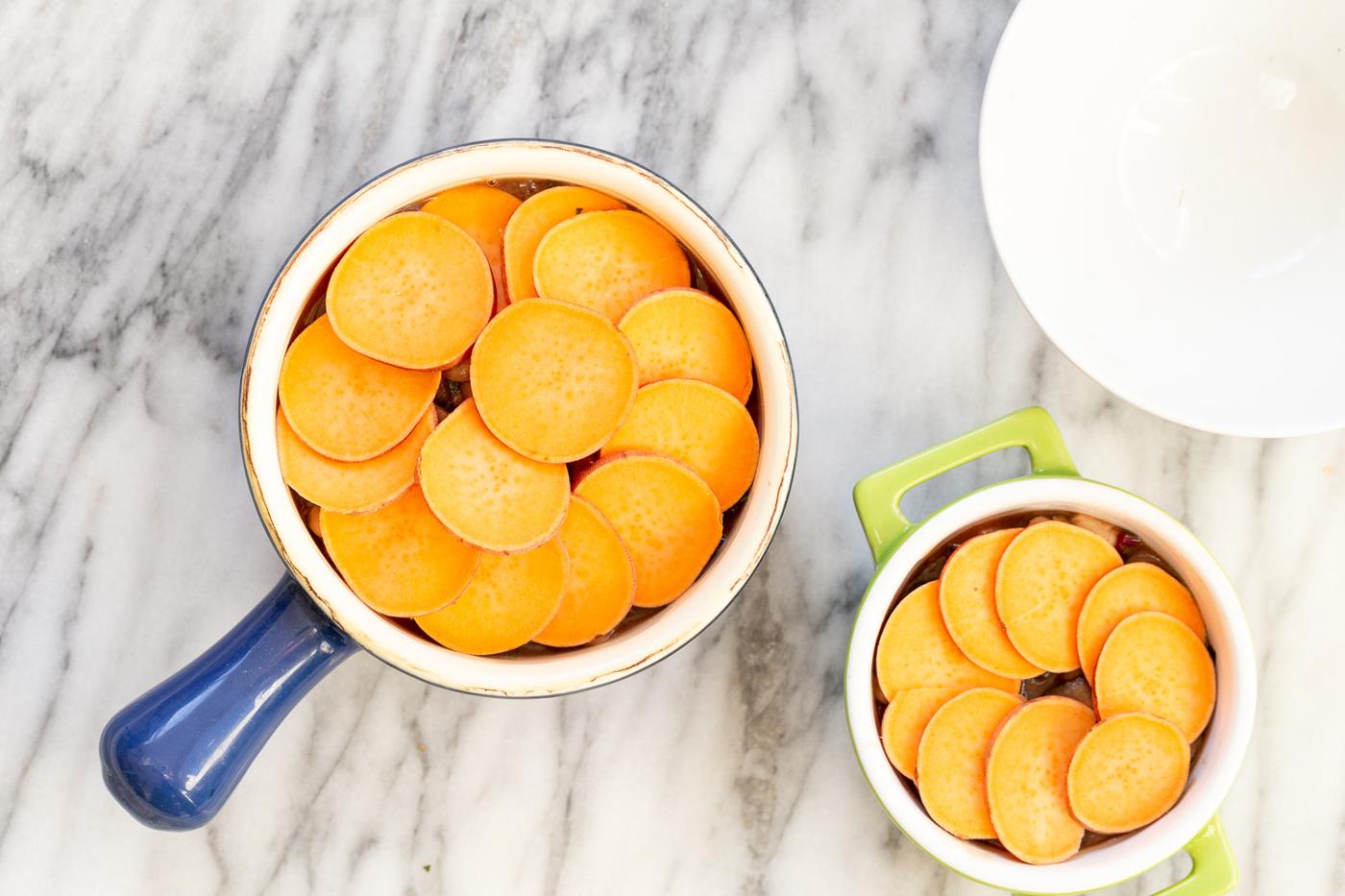 Our Vegan Mushroom Pot Pie in green and blue baking dishes
