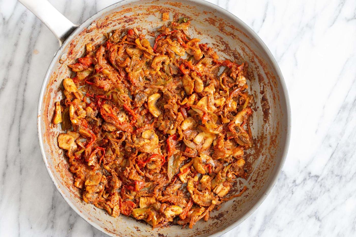 vegan mushroom bell pepper tostada filling in a frying pan