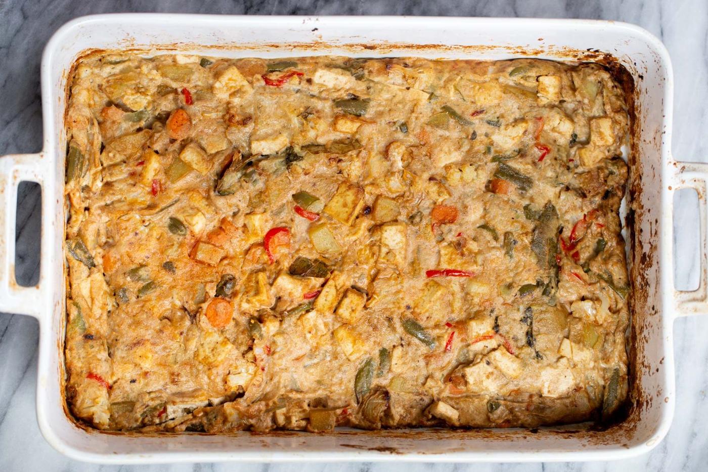 Baked Vegan Navratan Korma in a white casserole dish