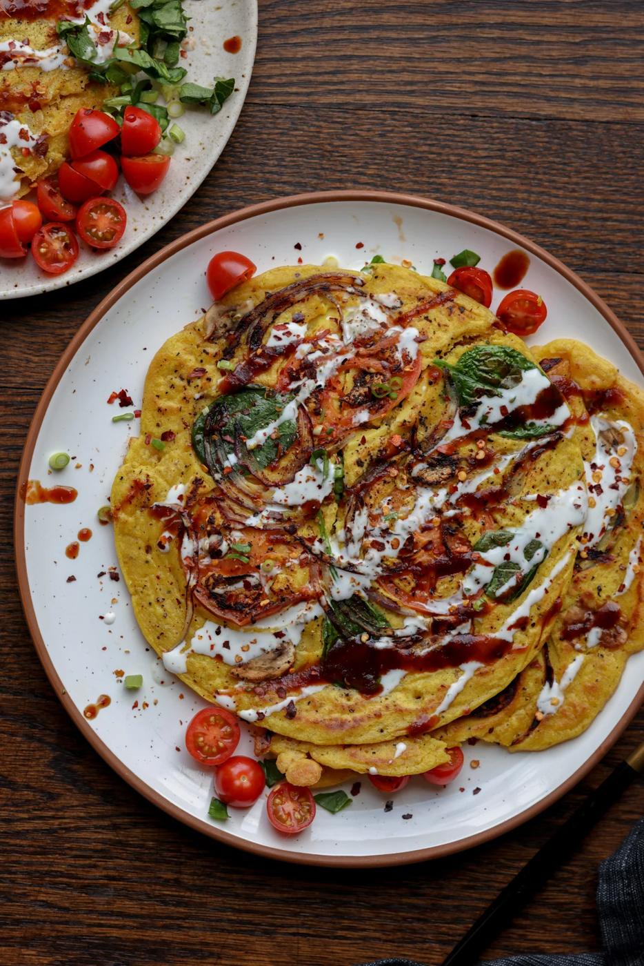 chickpea flour omelette topped with vegan yogurt