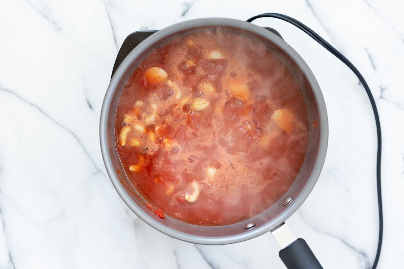 Vegan Paneer Lababdar sauce ingredients in a saucepan
