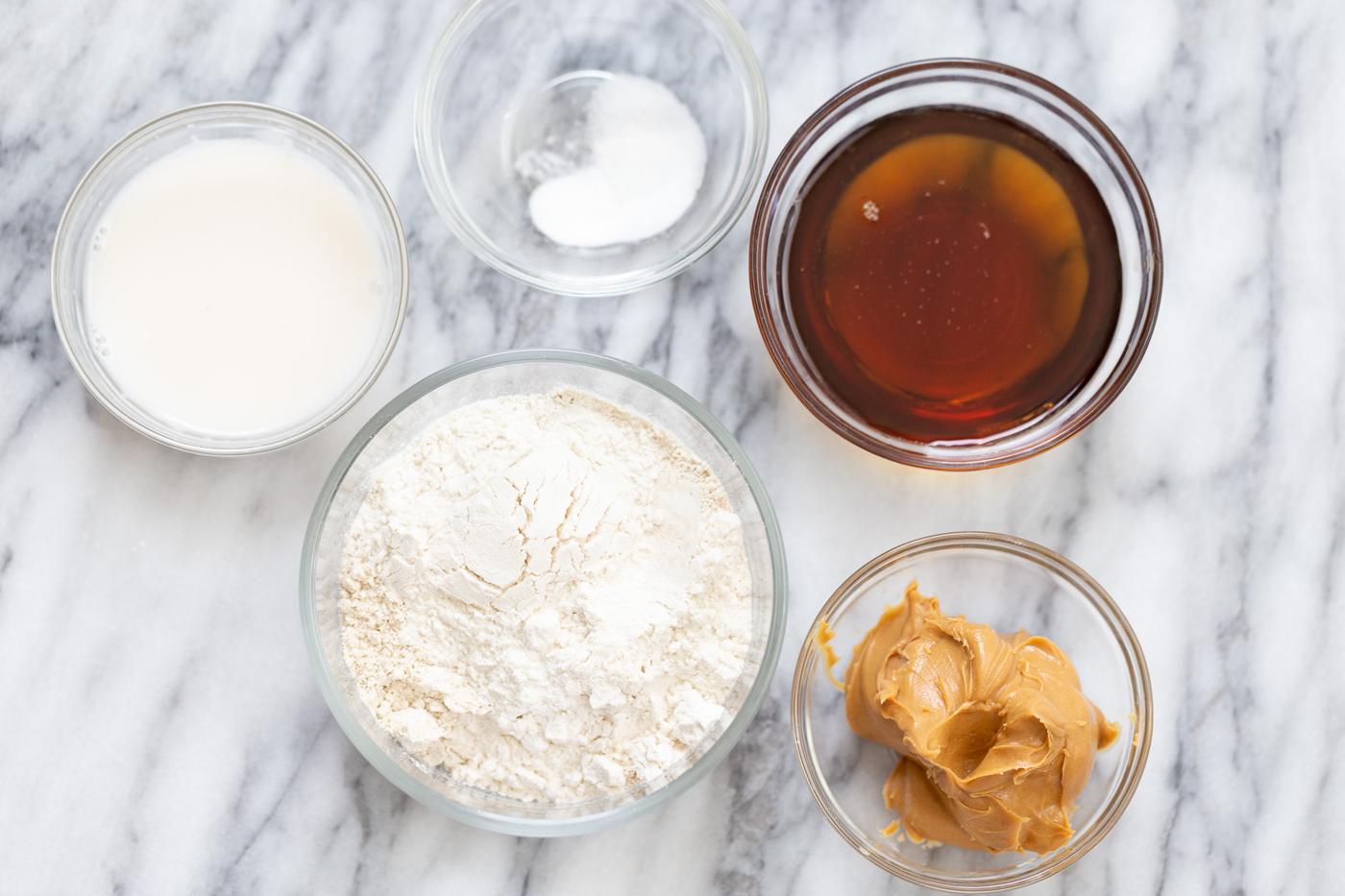 Ingredients for making vegan thumbprint cookies on a marble counter