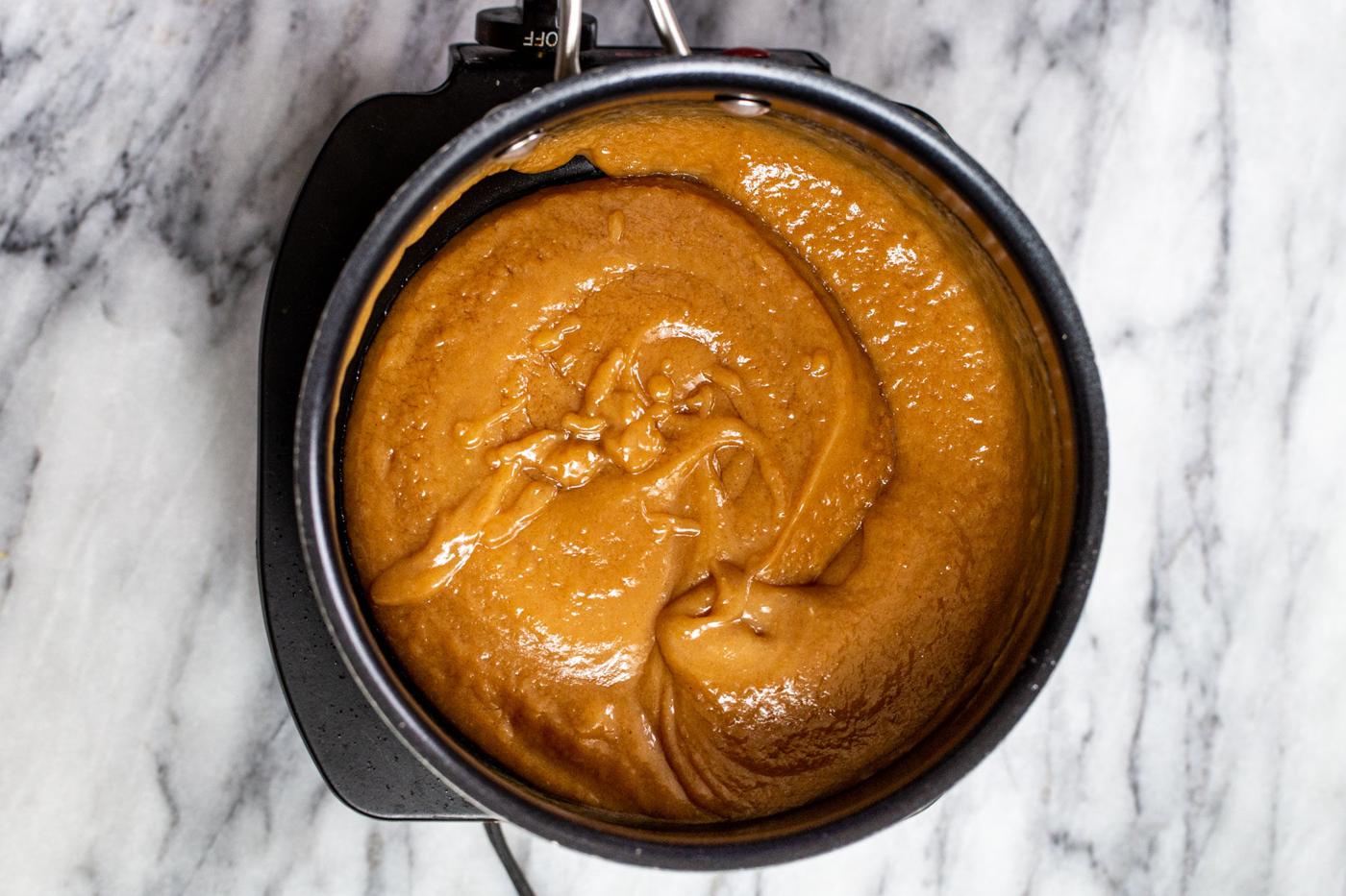 peanut butter filling for chocolate tarts in a saucepan