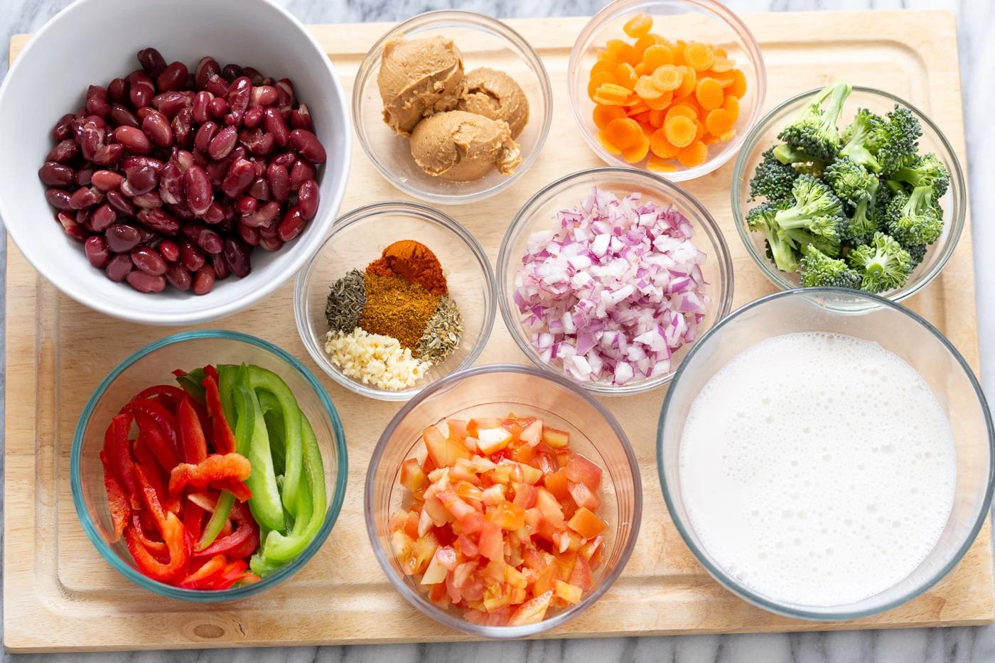 overhead shot of ingredients needed for making vegan kidney bean and peanut stew