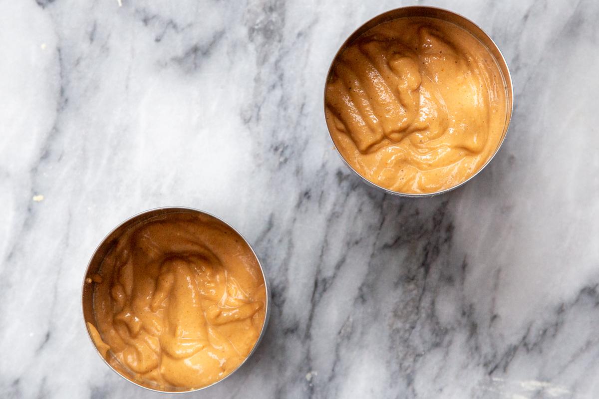 vegan pepperoni sausage batter being filled into cans