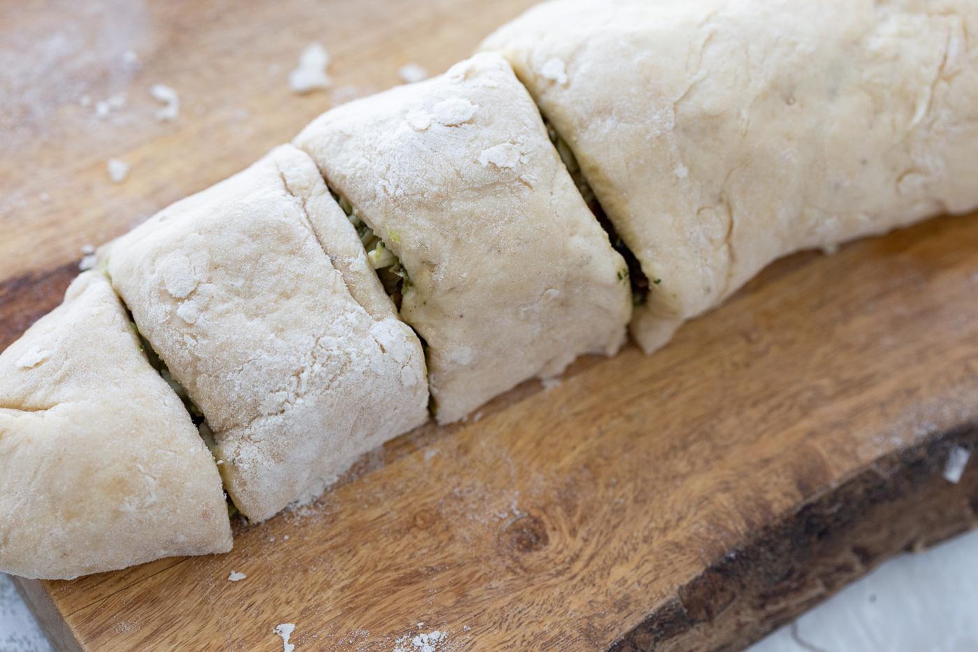 Pesto Pizza rolls on a cutting board