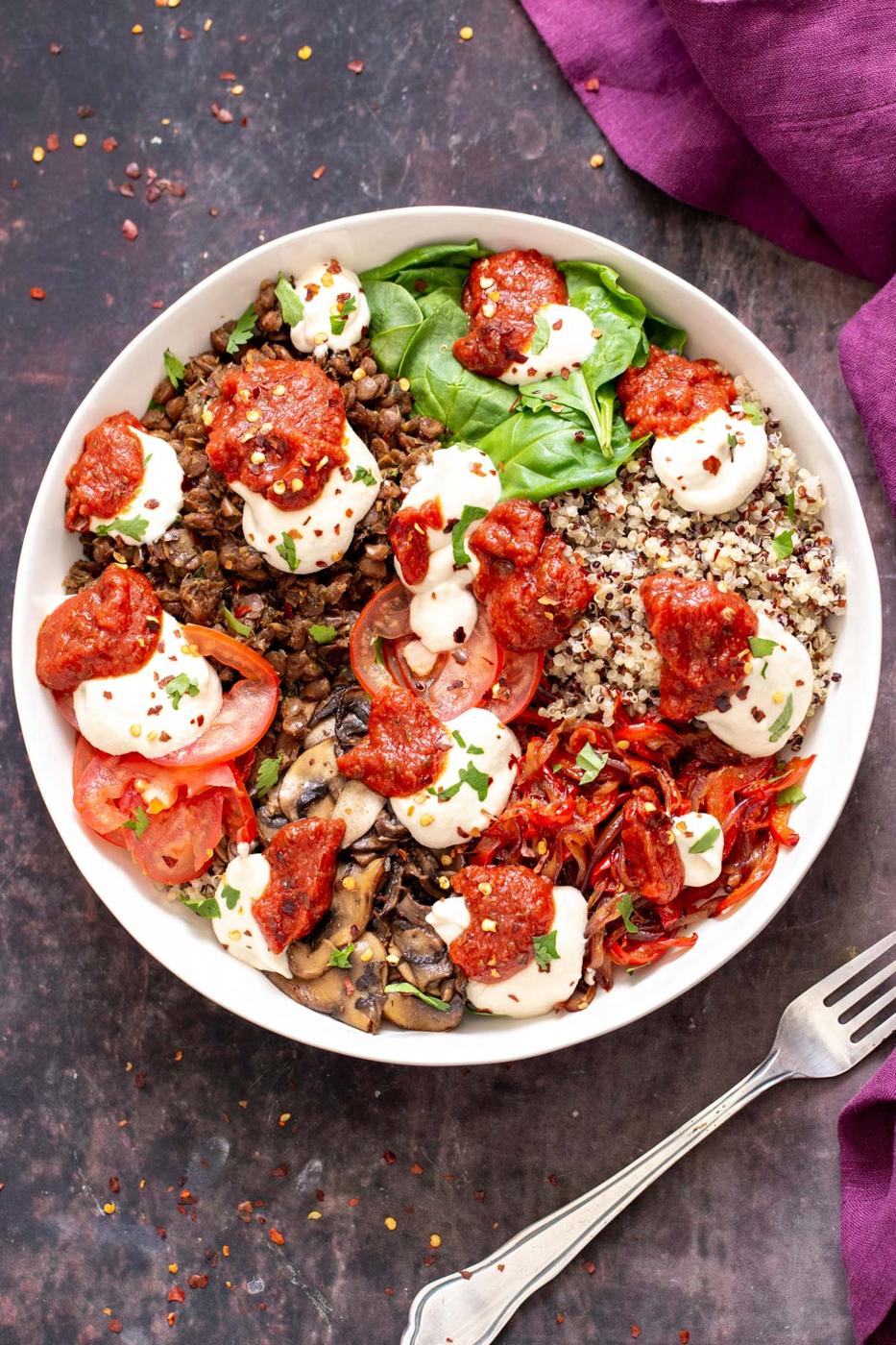 vegan quinoa pizza bowls topped with vegan mozzarella cheese and marinara sauce