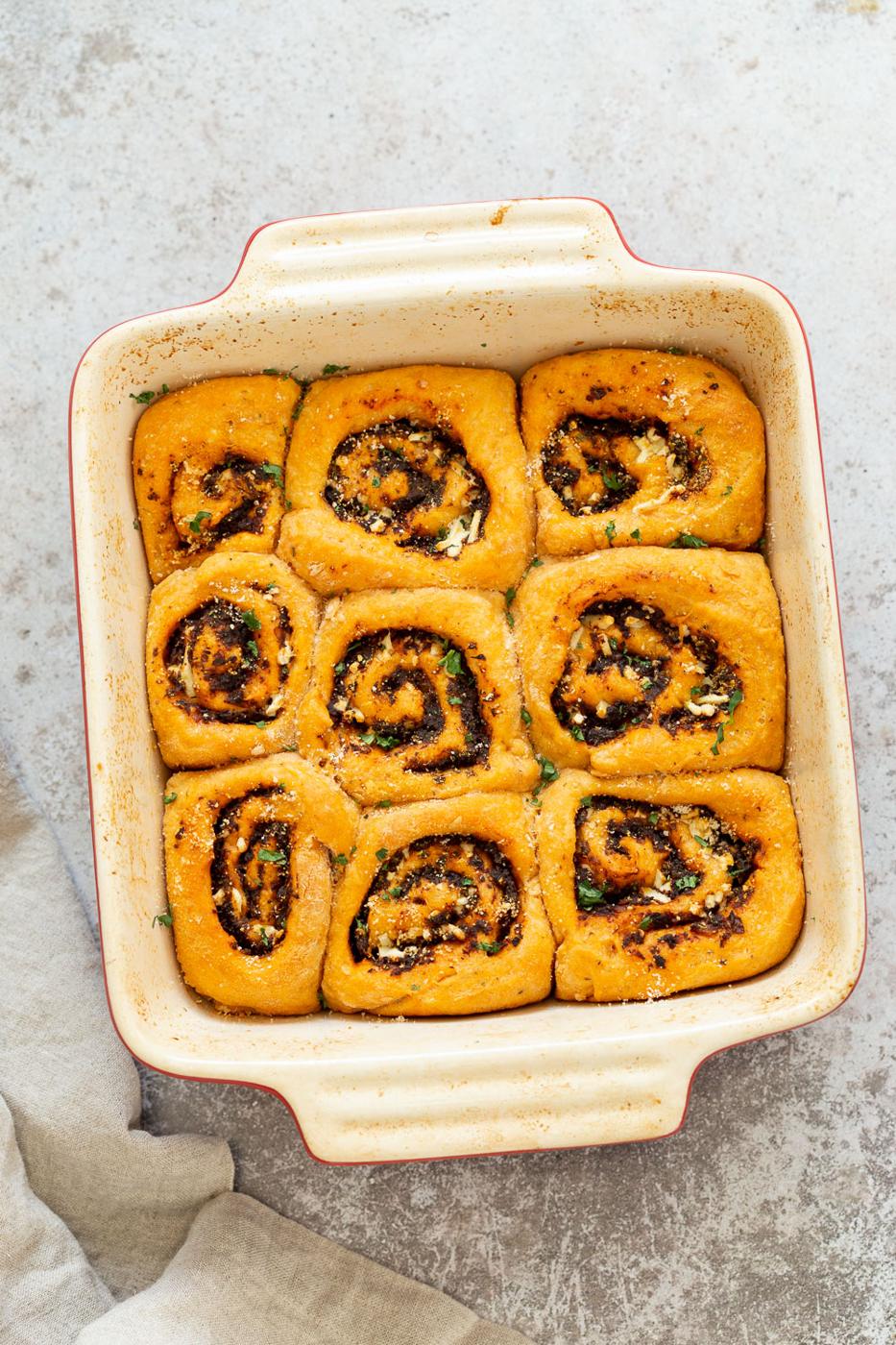 Vegan Pizza Rolls in a ceramic baking dish
