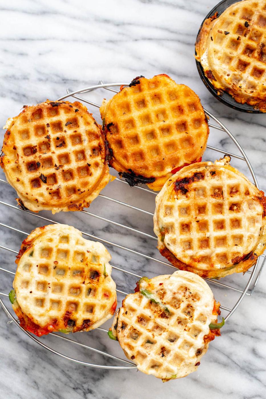 vegan pizza waffles chilling on a grid