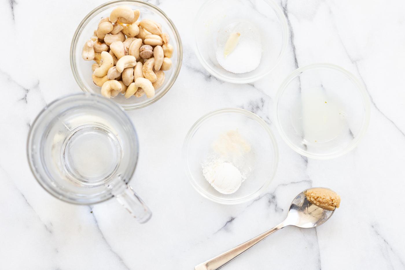 Vegan Mozzarella Cream ingredients in bowls for our Vegan Portobello Mushroom Burger