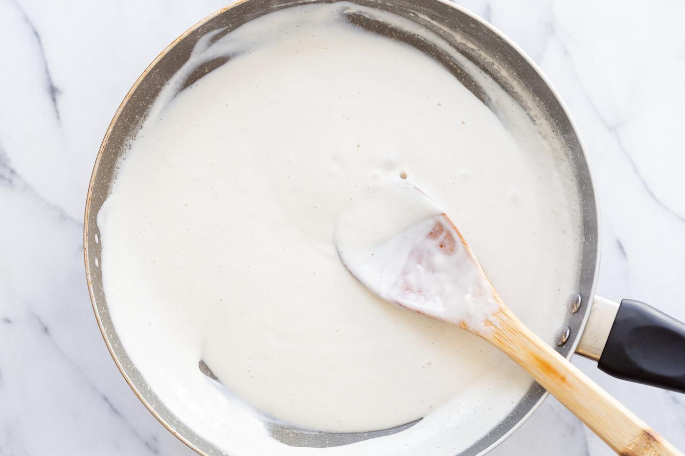 Vegan mozzarella cream in a skillet for our Vegan Portobello Mushroom Burger
