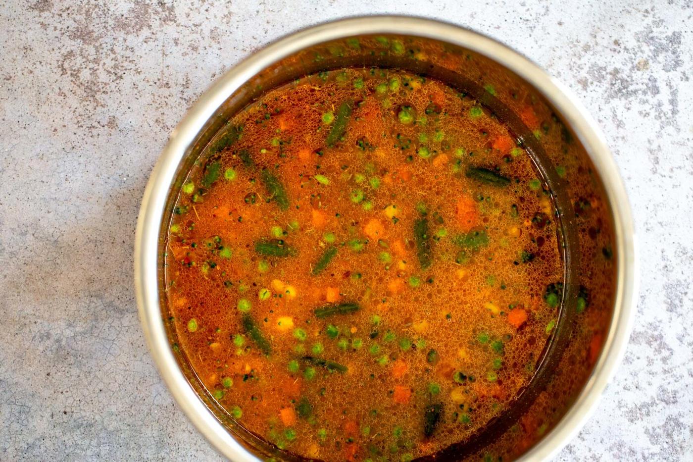 water being added to dry ingredients used for making Instant Pot Fried Rice