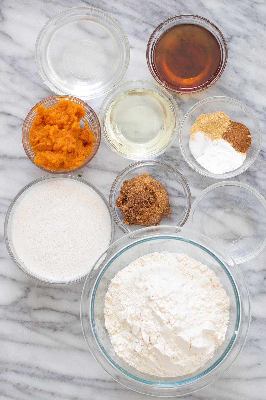 ingredients for vegan pumpkin pancakes on a marble slate