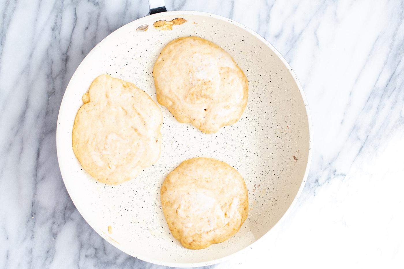 pumpkin pancakes in a frying pan