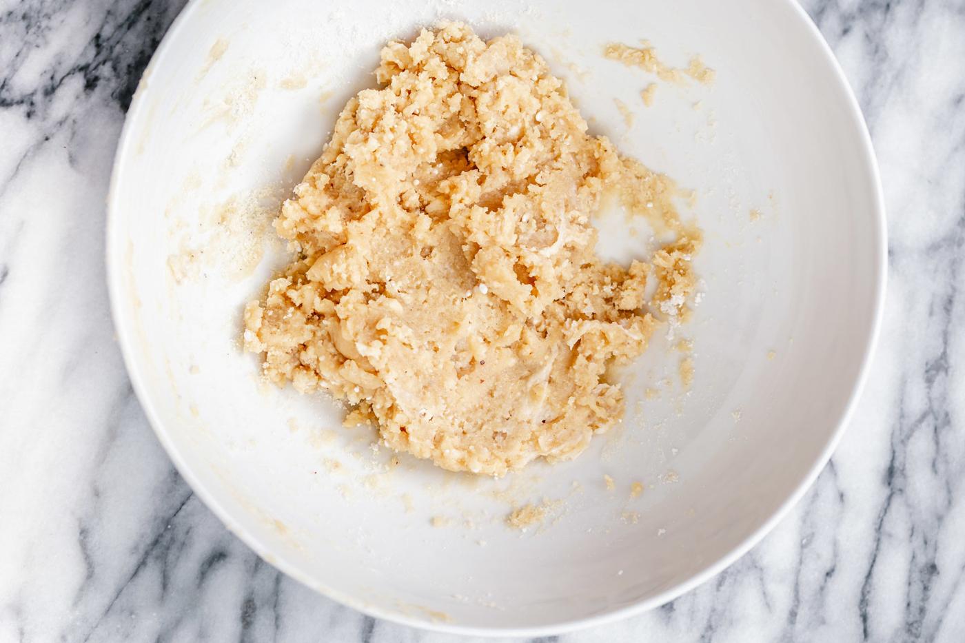 vegan rasmalai cake batter being combined in a bowl