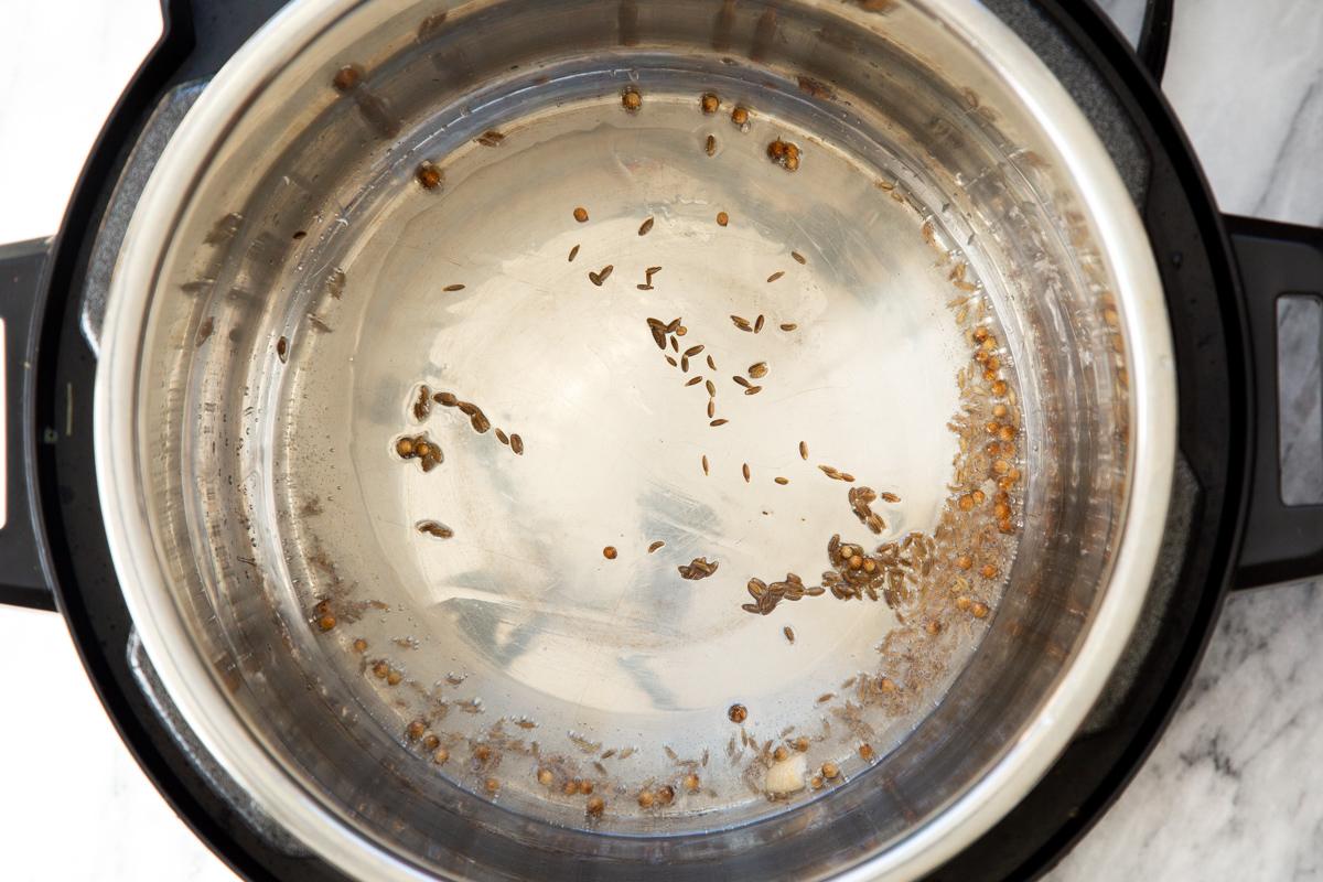 cumin seeds sizzling in an Instant Pot