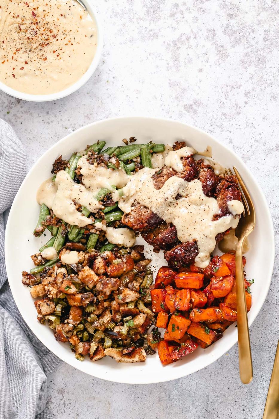 vegan sheet pan thanksgiving dinner served with vegan pan gravy