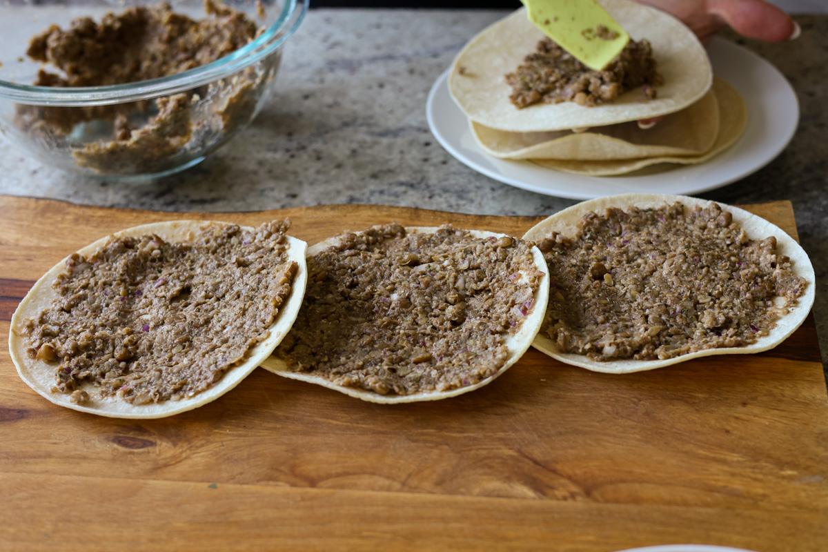 tortillas spread with the lentil meat mixture