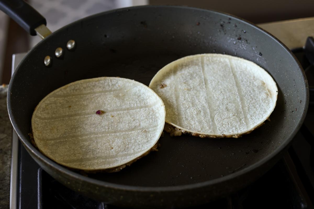 frying the lentil side of the vegan smashed tacos