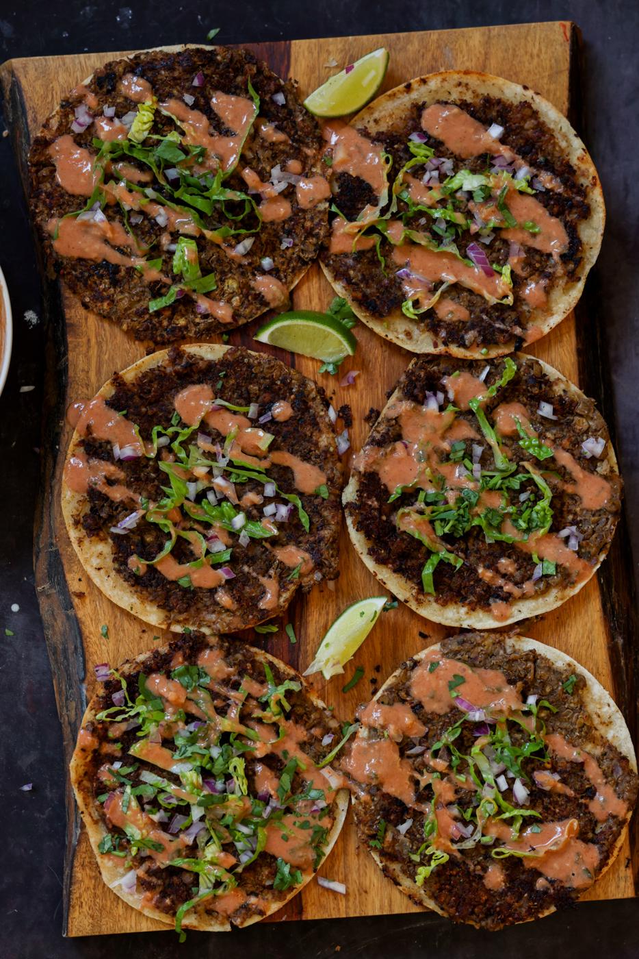 butter chicken smashed tacos on a serving tray