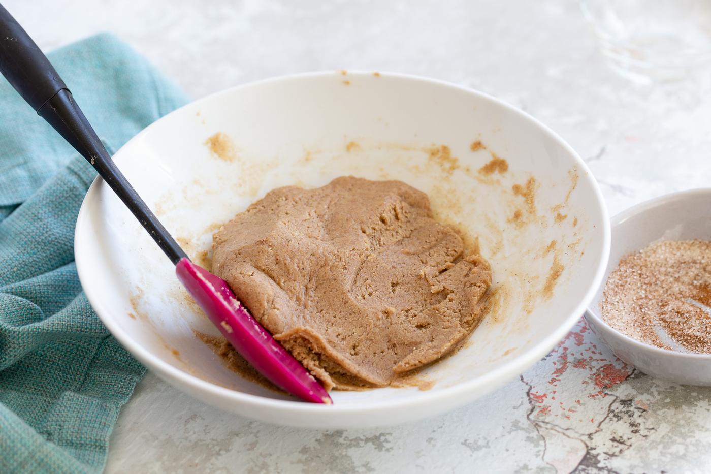 batter for rolling vegan Snickerdoodle bites in a white bowl
