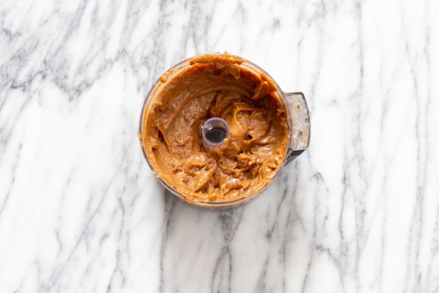 vegan date caramel in a food processor ready to be used as a filling for snickers