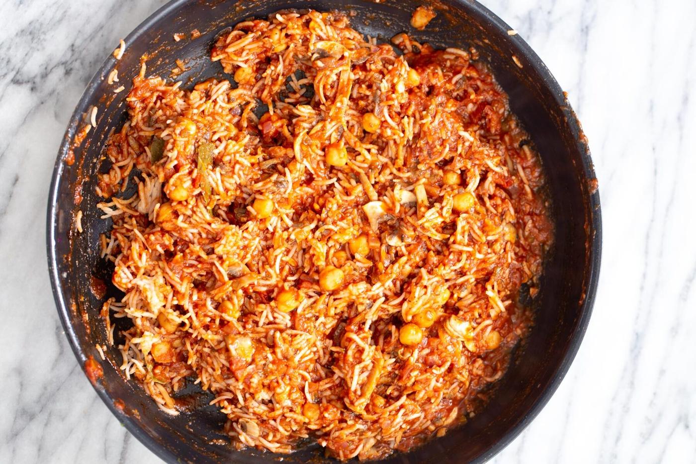 rice filling for stuffed bell peppers in a sauteeing pan