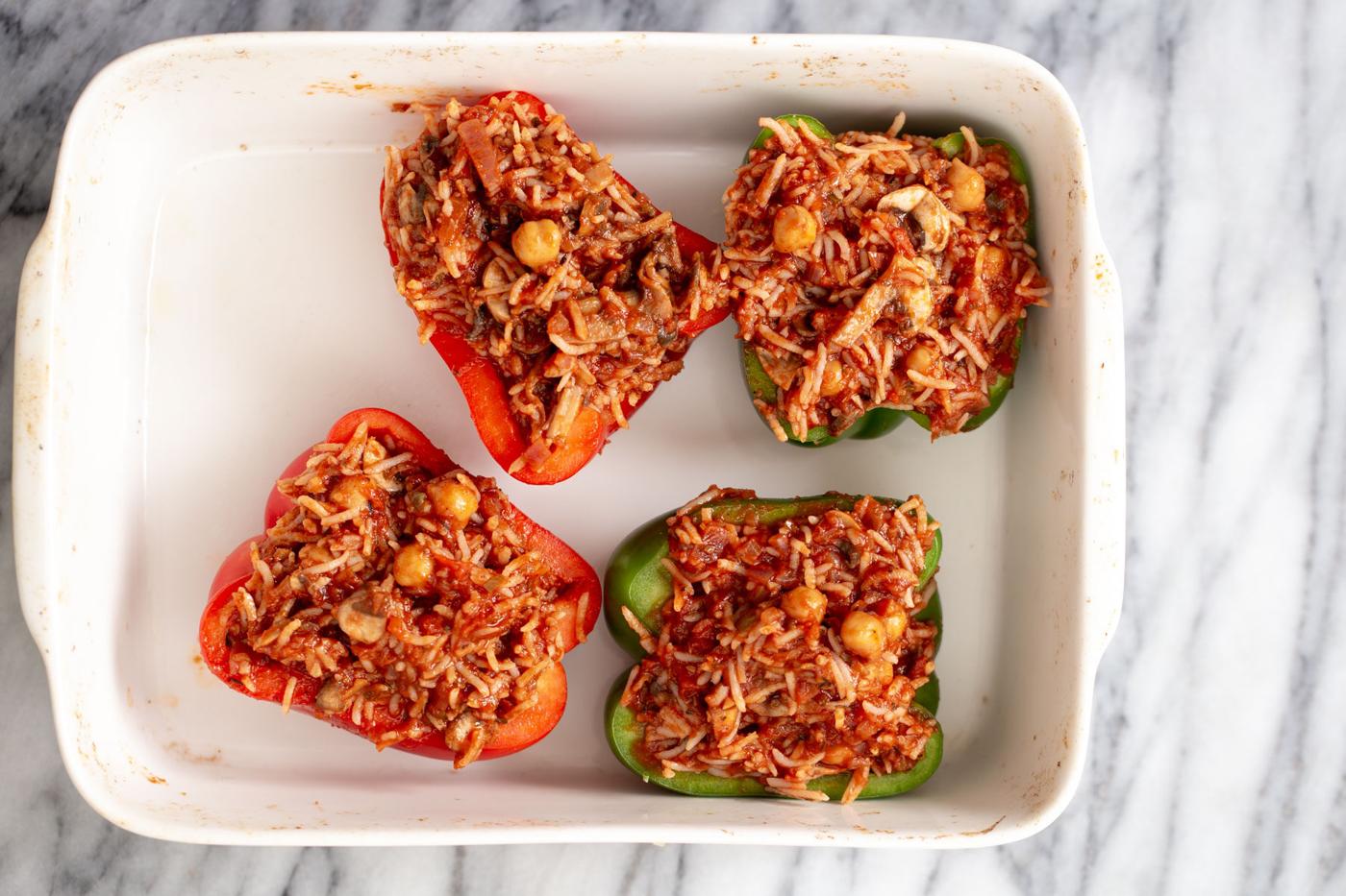filled stuffed bell peppers in a casserole dish